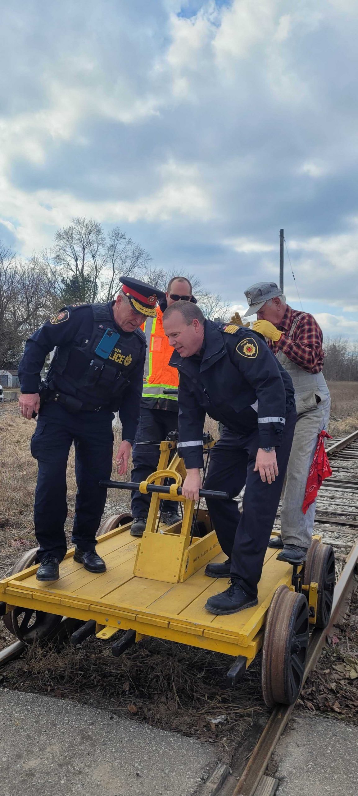 Aylmer Police Officers aboard Mr. Harding's handcar