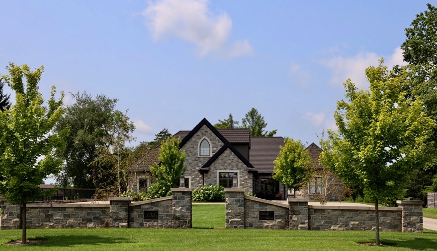 A multi-storey home with stonework exterior and a unique octagonal parlour